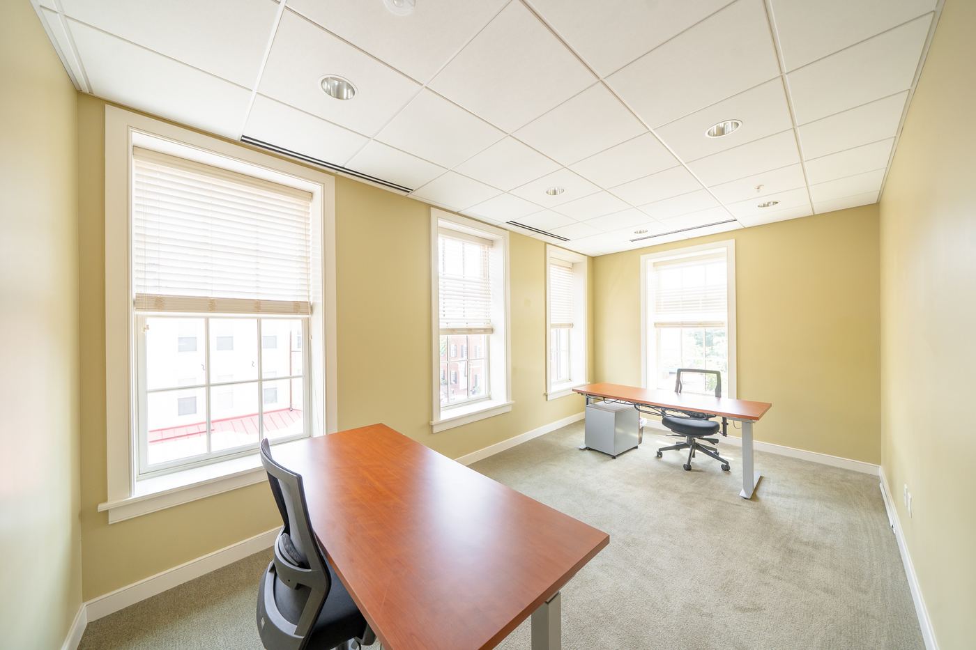 two desk private office with chairs and natural light